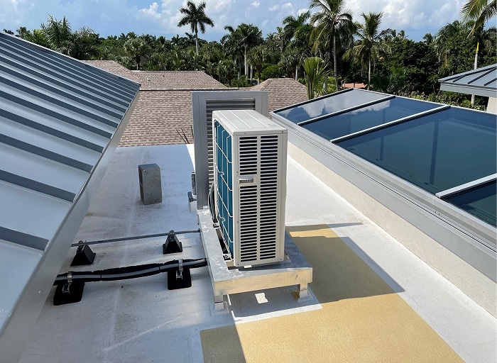 Rooftop condenser units installed at a Naples home